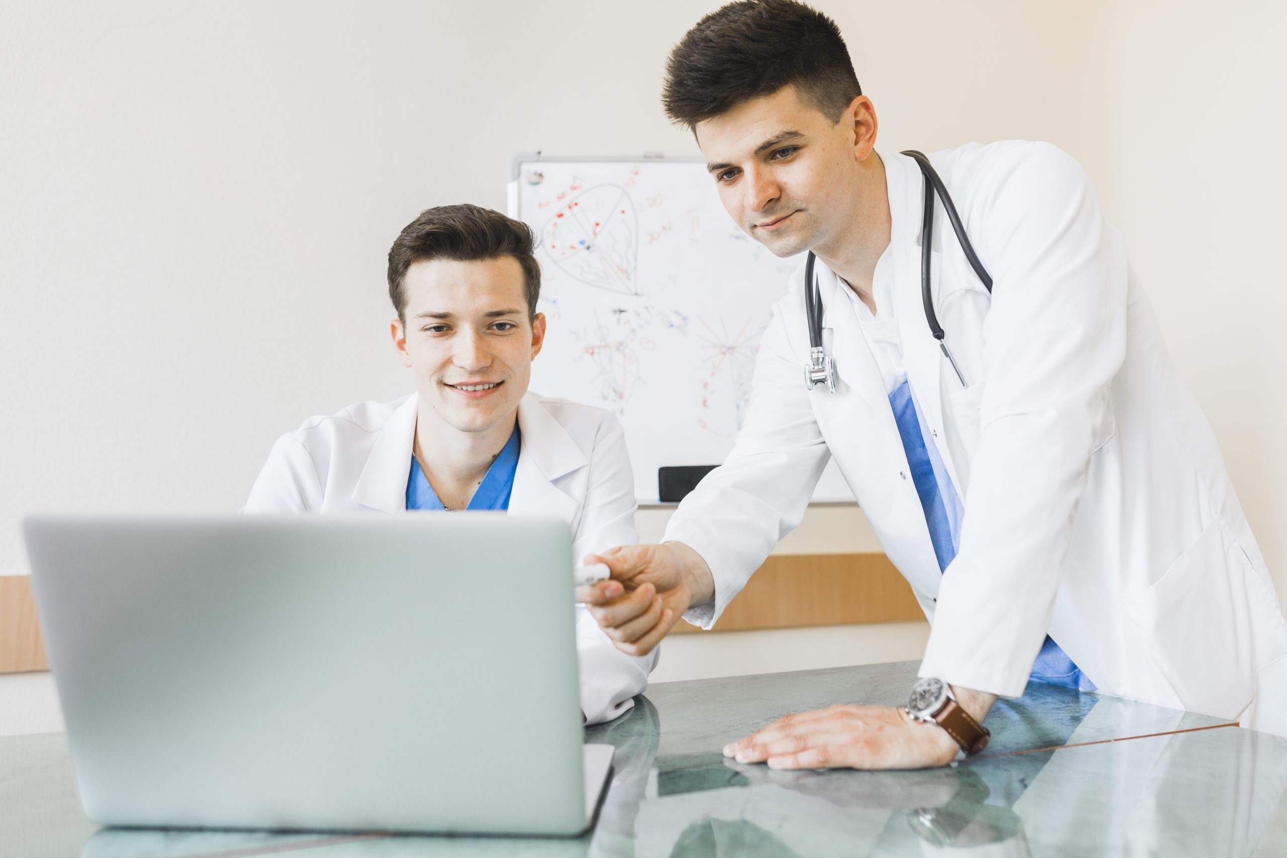 doctors-looking-laptop doctors-looking-laptop